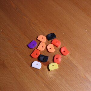 12 plastic key covers, flexible plastic, approx 1" wide